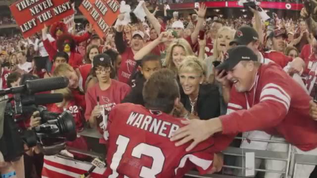 Alton, United States. 02nd July, 2021. Hall of Fame quarterback Kurt Warner,  and wife Brenda speak with reporters after surprising the Krikelas family,  with their new home in Alton, Illinois on Friday